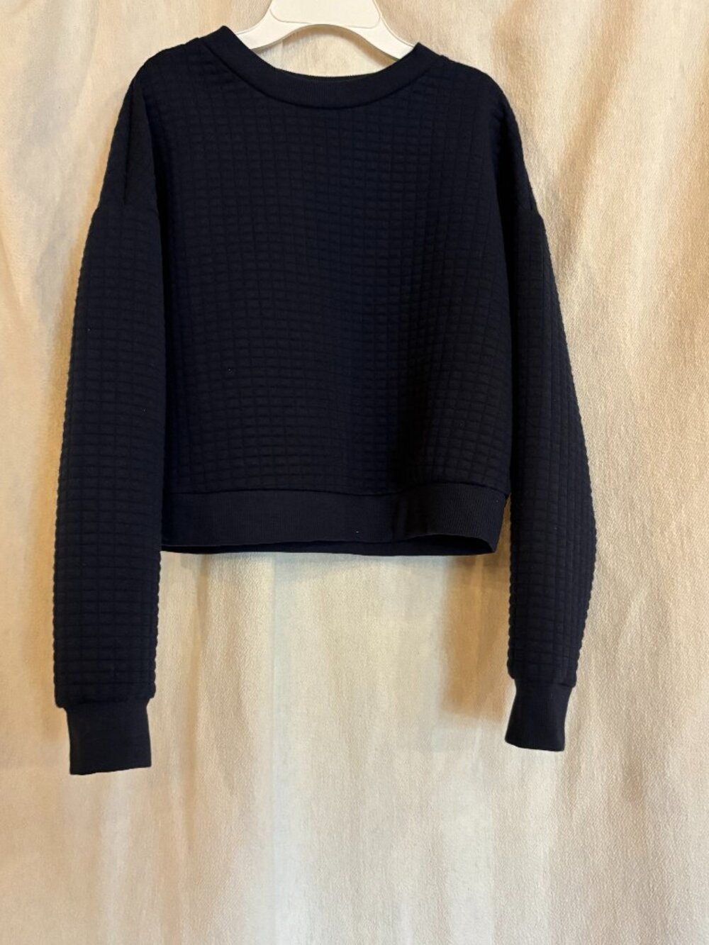 Dark blue sweater.